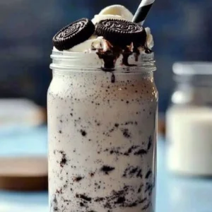 Delicious Oreo Milkshake topped with crushed Oreo cookies and whipped cream