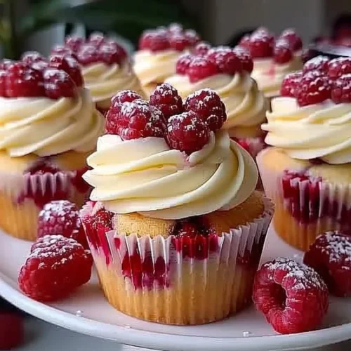 Almond wedding cake cupcakes with raspberry filling decorated for a wedding