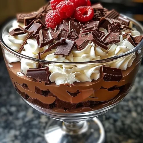 Delicious Baileys Chocolate Cheesecake Trifle layered with chocolate and cream.