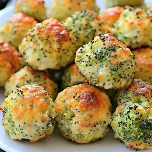 Delicious baked broccoli cheese balls served on a plate.