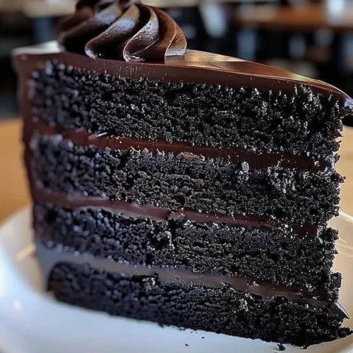 Delicious slice of Black Velvet Cake with cream frosting
