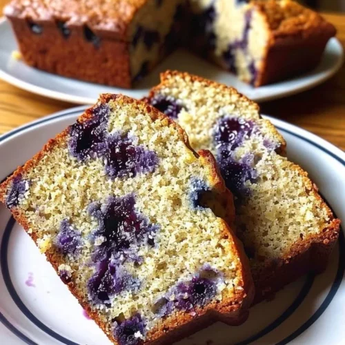 Freshly baked Blueberry Banana Bread with vibrant blueberries and ripe bananas.