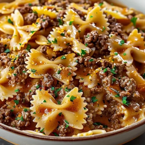 Delicious bowtie pasta with ground beef served in a bowl