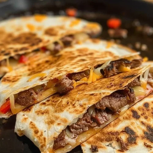 Delicious cheesy steak quesadillas with melted cheese and grilled steak.