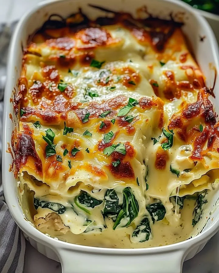 Creamy chicken and spinach casserole with cream cheese baked in a dish