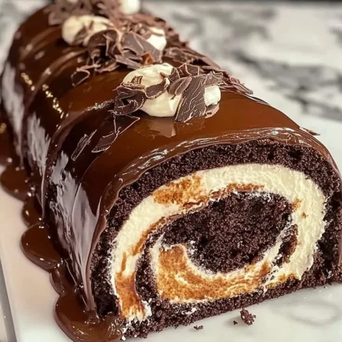 Delicious homemade Chocolate Cake Roll with creamy filling and chocolate frosting