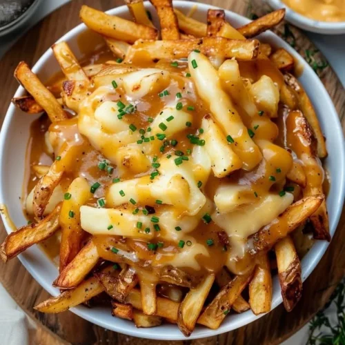 Delicious classic Canadian Poutine with fries, cheese curds, and gravy.