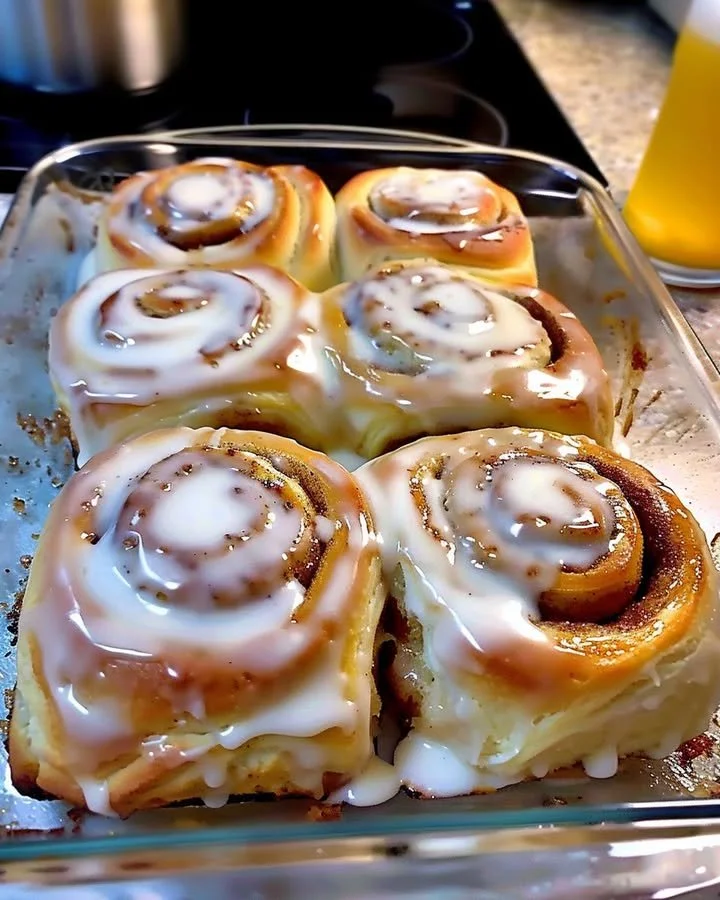 Freshly baked classic cinnamon rolls topped with creamy frosting