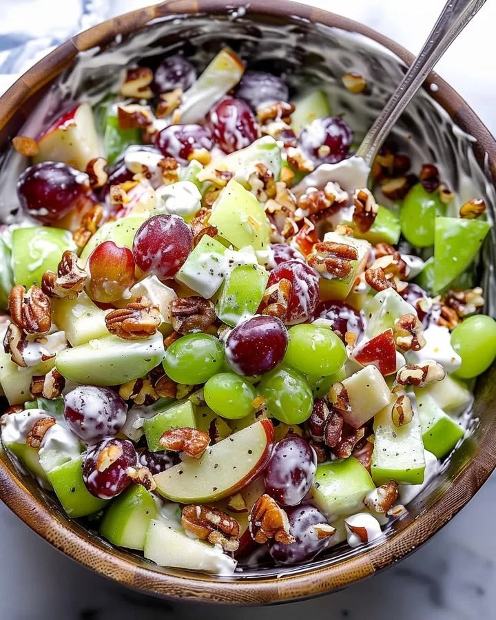 Classic Waldorf Salad with apples, walnuts, and celery in a bowl