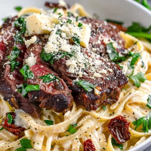 Delicious Steak Gorgonzola Alfredo with creamy sauce and tender steak slices