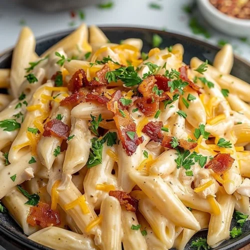 Creamy Crack Chicken Penne dish garnished and served in a bowl