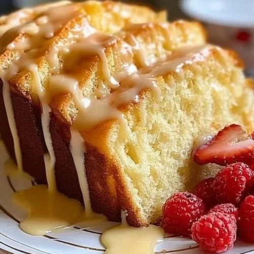 Delicious slice of cream cheese pound cake on a white plate