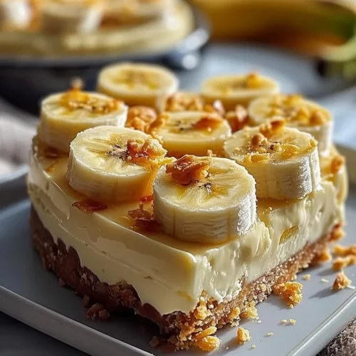 Delicious creamy banana cheesecake slice with banana topping