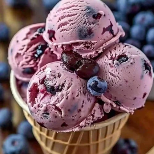 Crimson Choco Rhapsody ice cream in a vibrant bowl topped with chocolate shavings