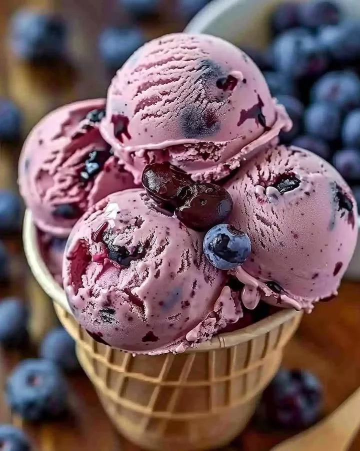 Crimson Choco Rhapsody ice cream in a vibrant bowl topped with chocolate shavings