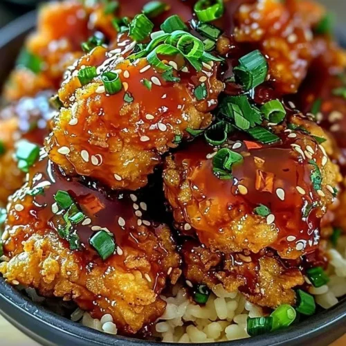 Crispy Bang Bang Chicken served on a plate with dipping sauce