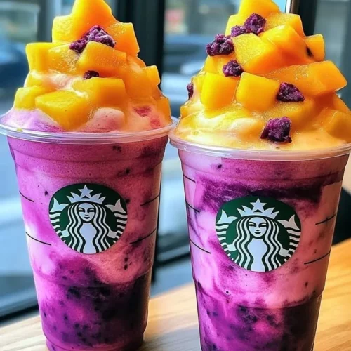 Dragon Fruit Mango Sunset Flushies Frappuccino in a glass with vibrant colors.