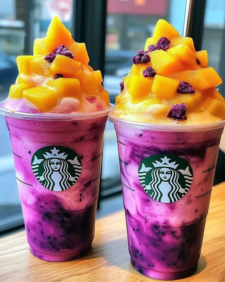 Dragon Fruit Mango Sunset Flushies Frappuccino in a glass with vibrant colors.