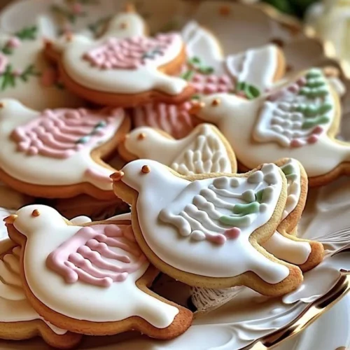 Elegant dove sugar cookies decorated with royal icing for special occasions