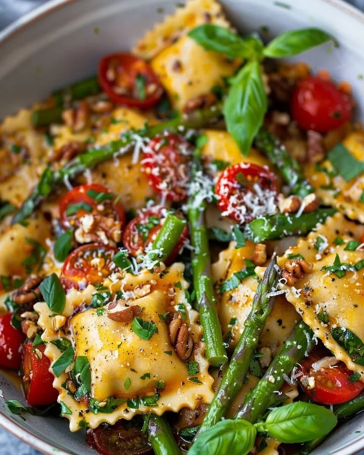 Delicious asparagus tomato ravioli tossed with fresh ingredients