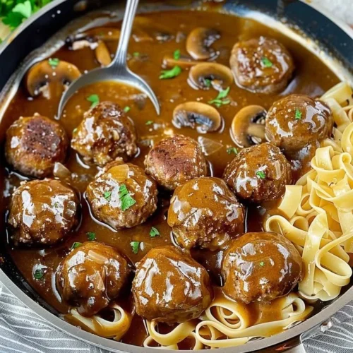 Gourmet meatballs in rich mushroom gravy served on a plate