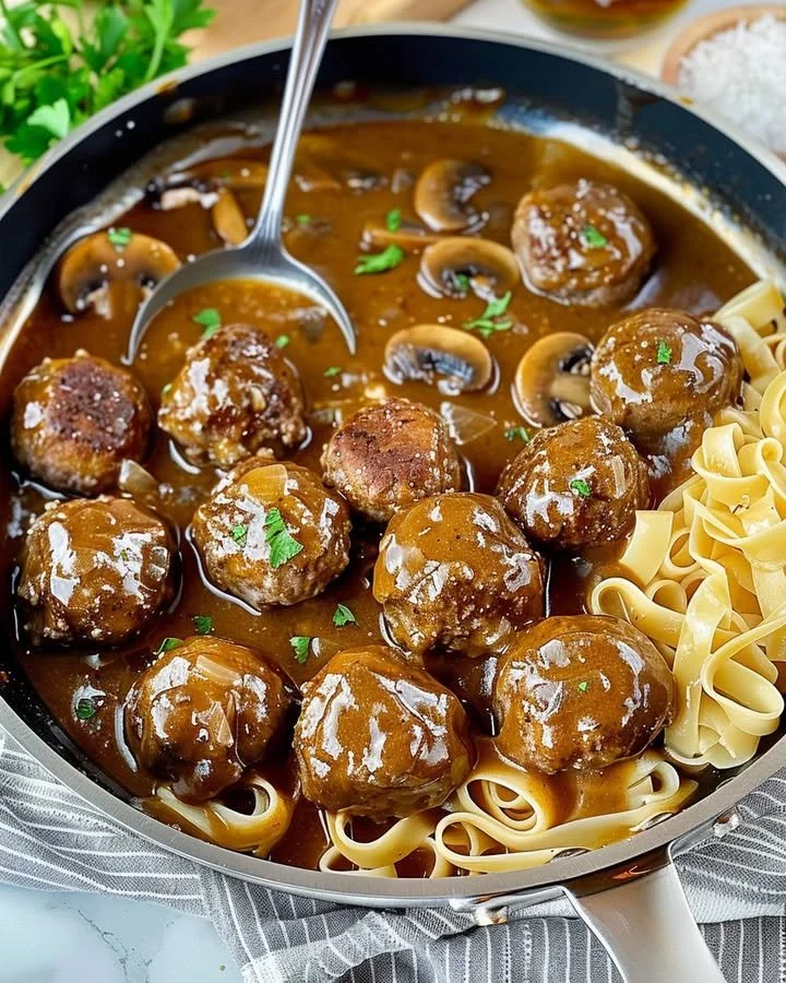 Gourmet meatballs in rich mushroom gravy served on a plate