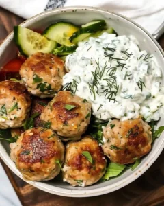 Greek Chicken Meatballs with homemade Tzatziki sauce on a plate