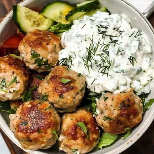 Greek Chicken Meatballs with homemade Tzatziki sauce on a plate