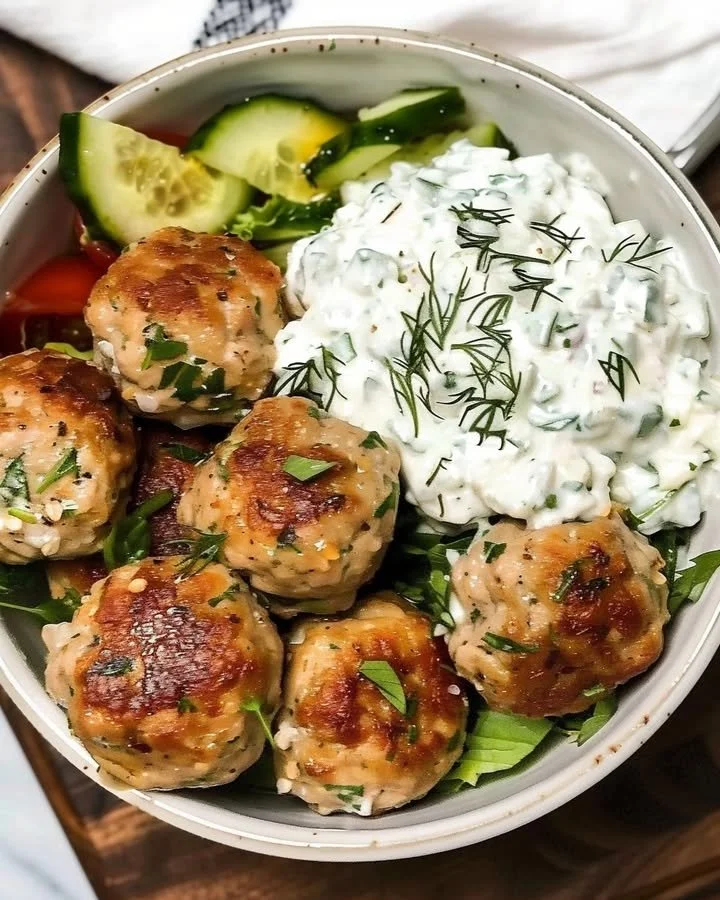 Greek Chicken Meatballs with homemade Tzatziki sauce on a plate