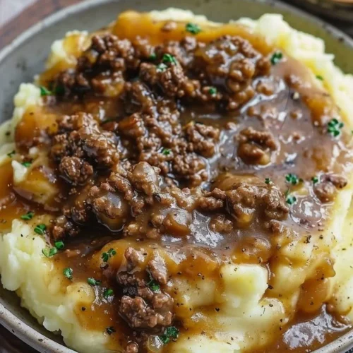 Ground beef and gravy served over fluffy mashed potatoes