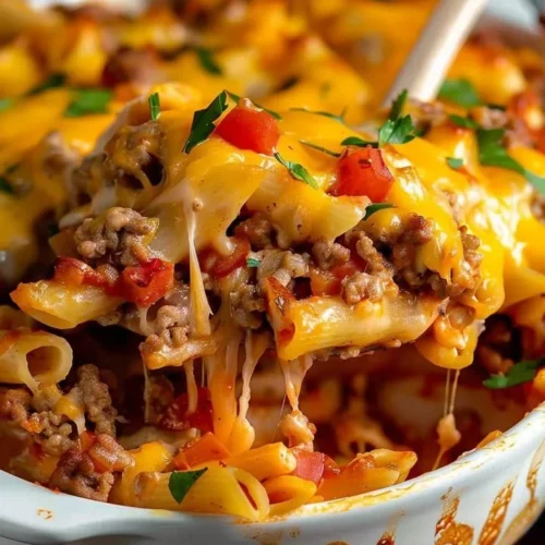 Homemade Hamburger Casserole served in a baking dish with cheese and vegetables.