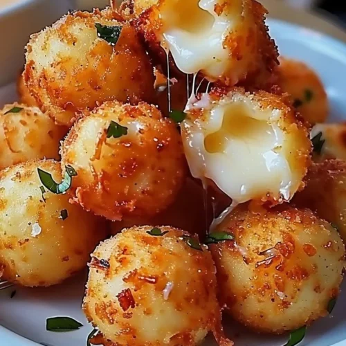 Plate of homemade fried cheese bites with crispy golden crust