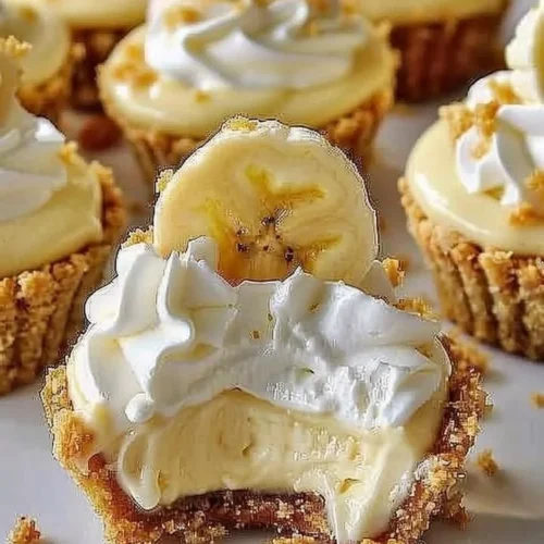 No-Bake Mini Banana Cream Pies topped with whipped cream and bananas