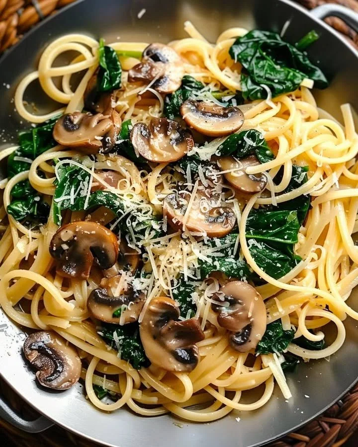 One Pot Garlic Parmesan Pasta with herbs and cheese in a bowl