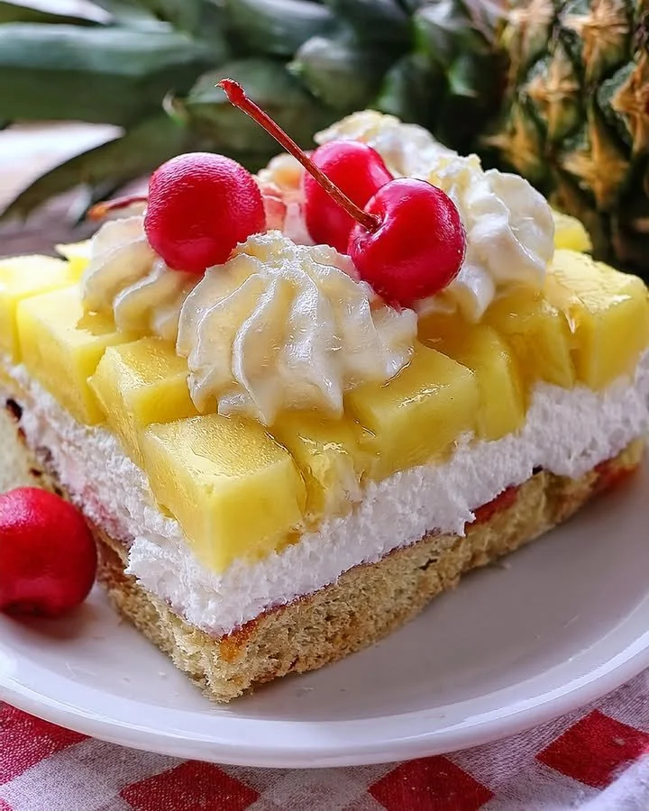Delicious Pineapple Heaven Cake topped with fresh pineapple slices