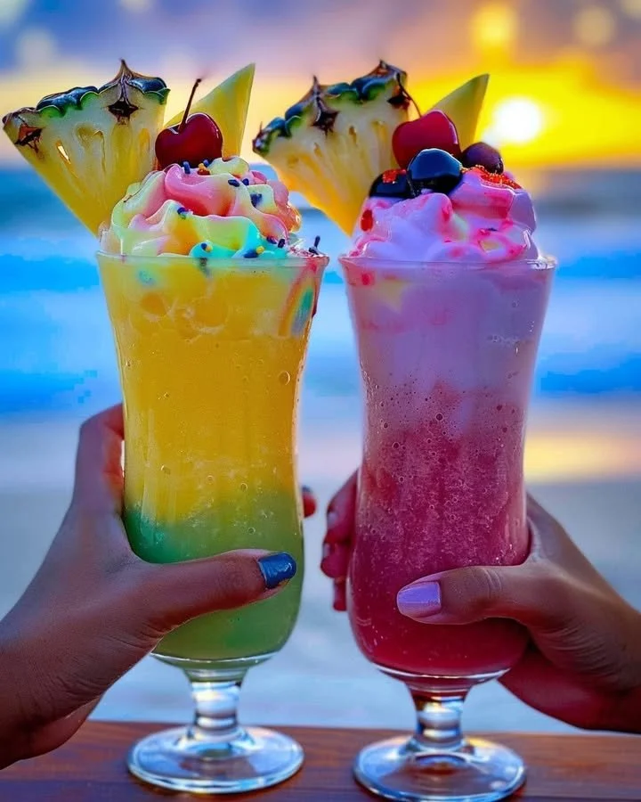 Colorful Rainbow Sherbet Piña Colada in a glass garnished with fruit