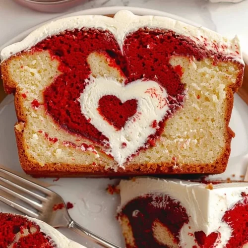 Delicious Red Velvet Loaf Cake with cream cheese frosting on a rustic table