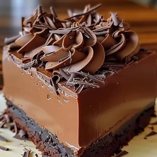 Decadent rich chocolate mousse cake layered with creamy chocolate topping