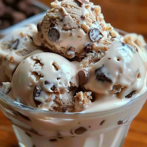 A delicious bowl of Rocky Road Ice Cream with chocolate, marshmallows, and nuts.