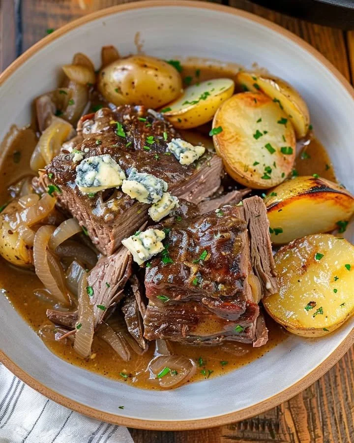 Savory Chuck Roast with Blue Cheese Gravy on a rustic wooden table