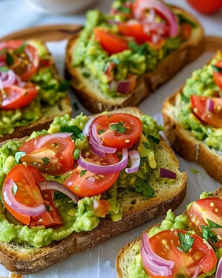 Smashed avocado bruschetta served on toasted bread