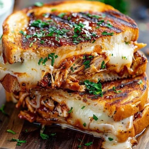 Smoky BBQ Chicken Meltdown served on a plate with fresh herbs and spices