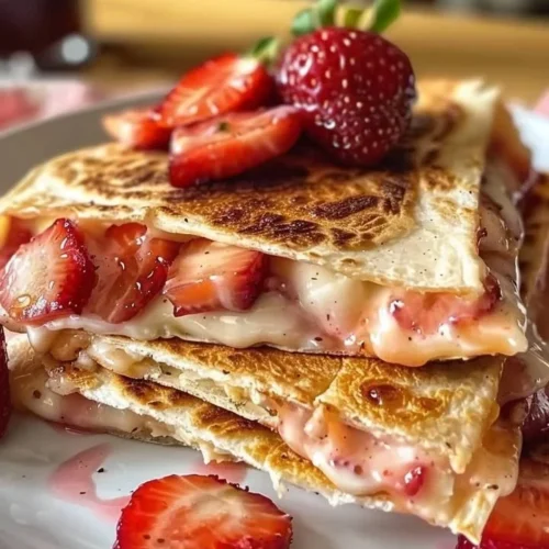 Delicious strawberry cheesecake quesadillas served on a plate