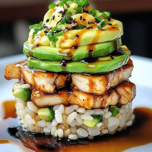 Teriyaki chicken avocado rice stack with colorful ingredients