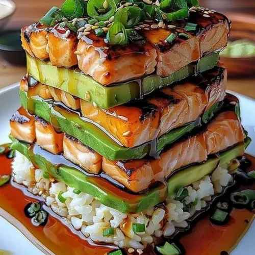 Delicious teriyaki salmon avocado rice stack layered with fresh ingredients