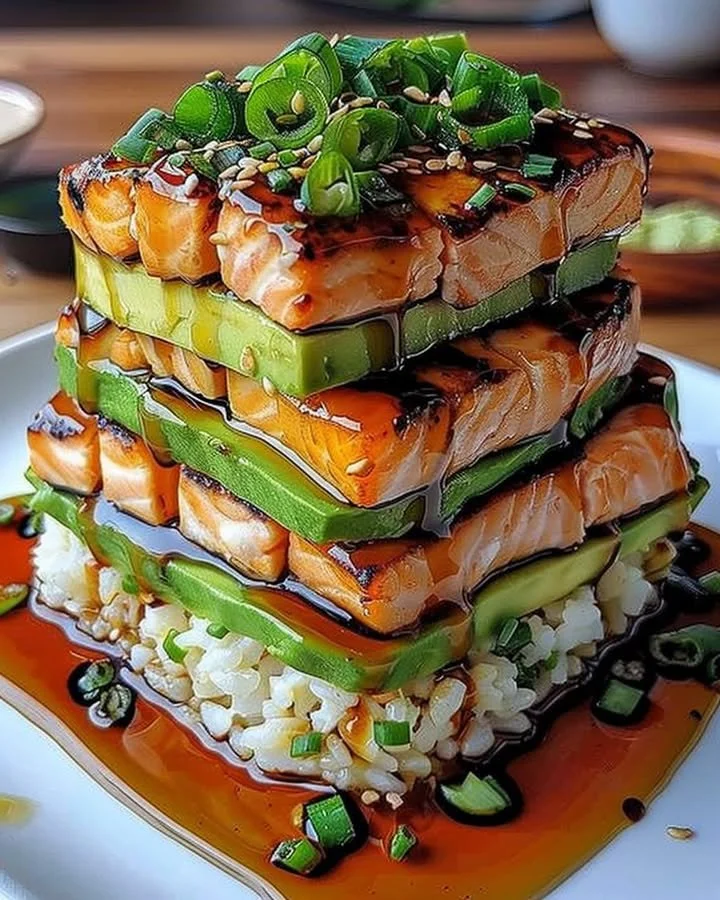 Delicious teriyaki salmon avocado rice stack layered with fresh ingredients