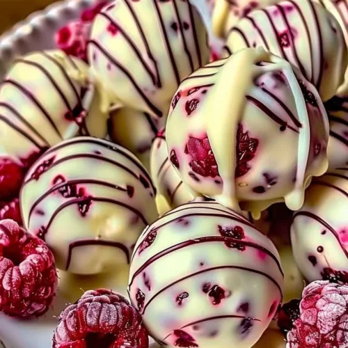 White chocolate raspberry cheesecake balls for a delicious dessert treat